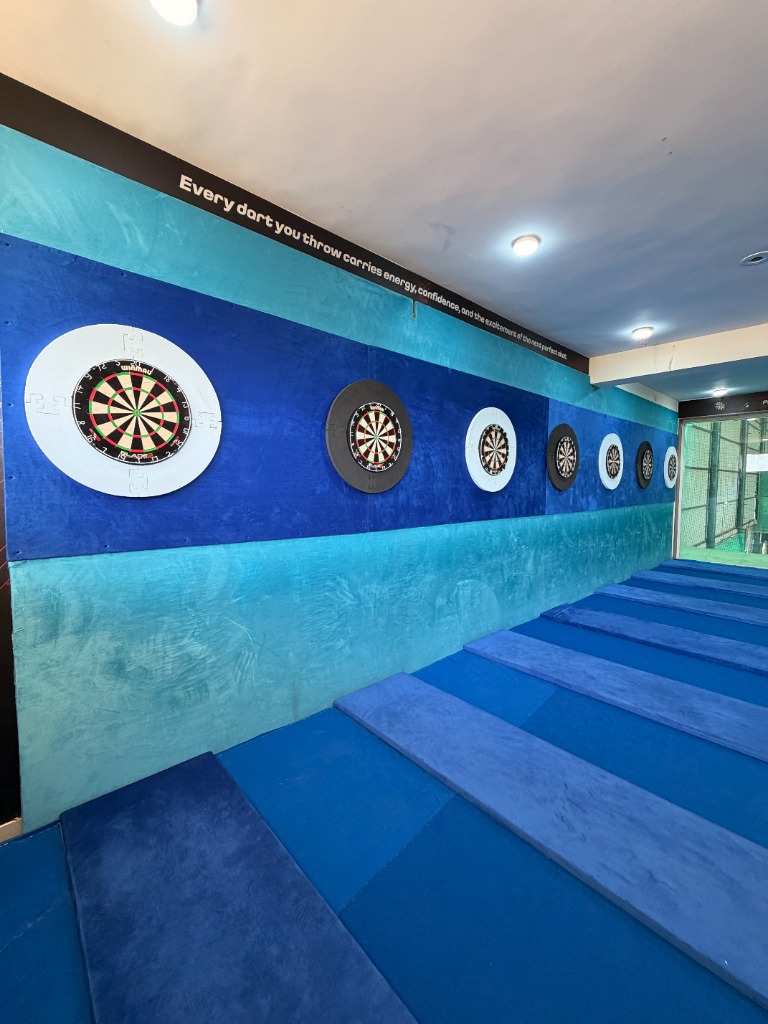 Professional Winmau dartboard setup at Darts Club facility Palodia